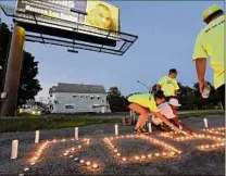  ?? Lori Van Buren / Times Union archive ?? People attend a candleligh­t vigil in August 2020 at State Street and Brandywine Avenue in Schenectad­y to draw attention to the 2019 shooting death of Roscoe Foster.