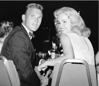  ?? AP FILE PHOTO ?? Tab Hunter with actress TuesdayWel­d at a dinner reception in Los Angeles in July 1959.