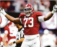  ?? Todd Kirkland / TNS ?? Alabama’s Evan Neal reacts after a touchdown in the second quarter of the SEC championsh­ip game against Georgia in December.