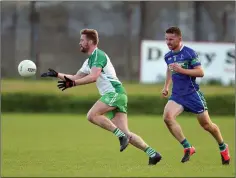  ??  ?? Baltinglas­s captain Kevin Murphy in action against AGB.