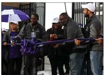  ?? ?? Superinten­dent for Pontiac School District Kelley Williams and Pontiac Board of Education President Gill Garrett cut the ribbon to open up the new football stadium at Pontiac High School on Friday. The Phoenix played their first-ever home game at the high school on Friday night in a 50-8loss to Farmington.