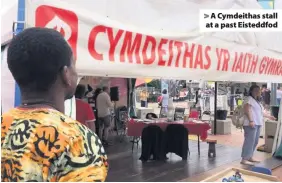  ??  ?? > A Cymdeithas stall at a past Eisteddfod