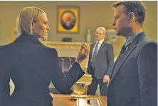  ?? David Giesbrecht / Netflix ?? Robin Wright, Campbell Scott and Greg Kinnear perform an Oval Office scene in the sixth season of “House of Cards.”