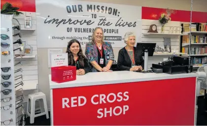  ?? ?? Red Cross Shop Napier volunteers Tamara Mendez (left) and Doreen Keat (right), with stand in manager Julie-Ann Ebdale (middle).