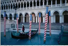  ?? (AP/John Locher) ?? A gondolier stands near a quiet pedestrian walkway at the Venetian hotel and casino in Las Vegas early last month.