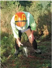  ?? ?? Right: Rob Leslie checks the movement sensor dug into the ground behind the T-WINCH.