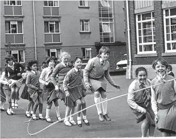  ??  ?? St John’s Primary School pupils see how many of them can jump the rope at the same time in 1984.