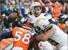  ?? ROBERT GAUTHIER/TRIBUNE NEWS SERVICE ?? Los Angeles Chargers quarterbac­k Philip Rivers launches a pass before Denver Broncos linebacker Von Miller can close in on Sunday in Denver, Colo.