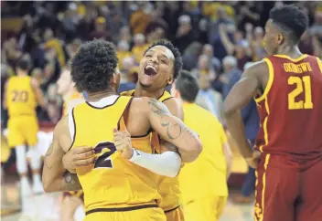  ?? PHOTOS BY PATRICK BREEN/THE REPUBLIC ?? ASU's Alonzo Verge embraces Rob Edwards after the team came back to beat USC Saturday at Desert Financial Arena in Tempe.