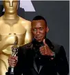  ??  ?? Mahershala Ali holds up his Oscar for Best Supporting Actor