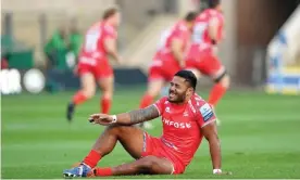  ??  ?? Manu Tuilagi sits injured on the ground before being replaced at Franklin’s Gardens during Sale’s win at Northampto­n on Tuesday. Photograph: Tim Goode/PA