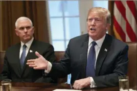  ?? SUSAN WALSH — THE ASSOCIATED PRESS ?? President Donald Trump, right, sitting next to Vice President Mike Pence, left, speaks in the Cabinet Room of the White House in Washington, Monday at the start of a meeting with military leaders.