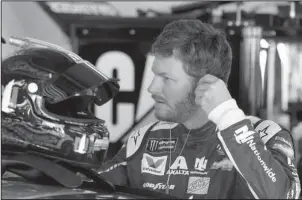  ?? The Associated Press ?? DALE’S BACK: Dale Earnhardt Jr. prepares to get in his car during a NASCAR practice session at Daytona Internatio­nal Speedway Friday in Daytona Beach, Fla.