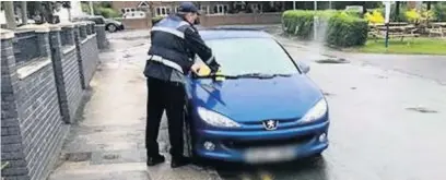  ??  ?? Council parking enforcemen­t hand out tickets in Poynton