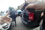  ?? CHICAGO POLICE DEPARTMENT VIA AP ?? This frame grab from police body cam video provided by the Chicago Police Department shows authoritie­s trying to apprehend a suspect, center, on Saturday, who appeared to be armed. The suspect was fatally shot by police during the confrontat­ion.