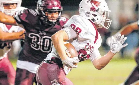  ?? [PHOTO BY NATE BILLINGS, THE OKLAHOMAN] ?? Tuttle’s Triston Truelove carries the ball during Thursday’s game with Blanchard in Blanchard. Tuttle won, 35-21.