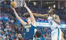  ?? Sue Ogrocki, Associated Press file ?? Jerami Grant, right, and Nikola Jokic now figure to play in the same frontcourt for the Nuggets.