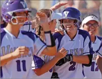  ?? Katharine Lotze/The Signal ?? Valencia’s Gabby Fundora (10), left, celebrates teammate Kyla Hardy (2) game-winning walkoff hit over West Ranch following a softball game on Tuesday.