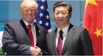  ?? - Reuters file ?? ELATED: The upcoming meeting between US President Donald Trump and Chinese President Xi provides an opportunit­y to reframe the conflict as a strategic challenge for the world’s two leading economies.