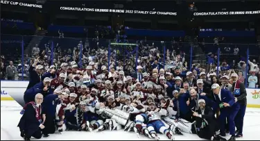  ?? Andy Cross / The Denver Post ?? The Colorado Avalanche pose for a group photo after defeating the Tampa Bay Lighting to win the Stanley Cup at Amalie Arena June 26.