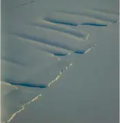  ?? ?? The Nansen Ice Shelf is fed by the Priestley and Reeves glaciers and abuts the northern edge of the Drygalski Ice Tongue along the coast of Victoria Land in East Antarctica. The Dreamliner’s windows provide an unrivalled view of the scenery below.