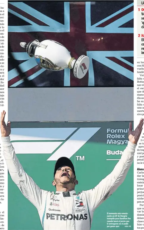  ?? FOTO: EFE ?? El momento más emocionant­e un GP de Hungría tranquilo para Hamilton fue cuando lanzó el jarrón que le entregaron en el podio por ganar ayer