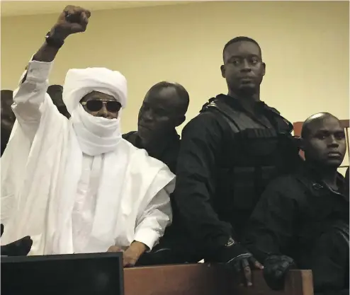  ?? CARLEY PETESCH / THE ASSOCIATED PRESS ?? Chad’s former dictator Hissène Habré raises his hand in court Monday in Dakar, Senegal, as a judge declared him guilty of crimes against humanity, war crimes, torture and sex crimes and sentenced him to life in prison.