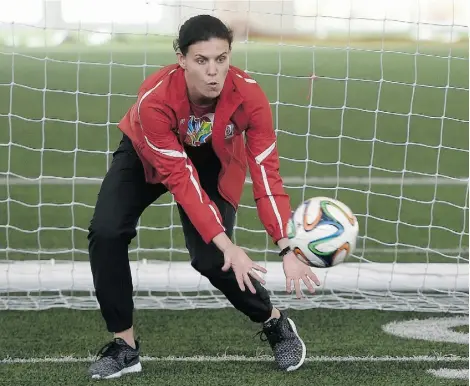  ?? JOHN LUCAS/ EDMONTON JOURNAL ?? Christine Sinclair usually scores goals, but she was trying to stop them during a U-12 Red Deer Renegades skills camp prior to the unveiling of a Canada Post Team Canada soccer stamp at Commonweal­th Stadium Community Rec Centre.