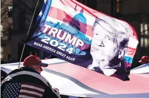  ?? Associated Press ?? ■ Protesters supporting former President Donald Trump march down Fifth Avenue last month on their way towards Times Square in New York. Trump ended his presidency with such a firm grip on Republican voters that party leaders fretted he would freeze the field of potential 2024 candidates, delaying preparatio­ns as he teased another run. Instead, many Republican­s with national ambitions are openly laying the groundwork for campaigns as Trump continues to mull his own plans.