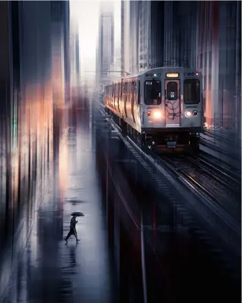  ??  ?? Above
MOTION BLUR
Trace went out onto the streets of Chicago, and an early-morning rain storm created extra reflection­s that added to the atmosphere he was looking for