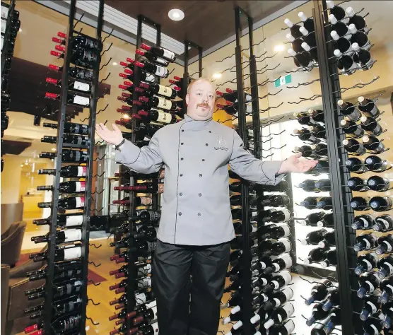  ?? PHOTOS: JIM WELLS ?? Executive chef Jeremy O’Donnell shows off the wine room at Headquarte­rs Restaurant in Westman Village in Mahogany.