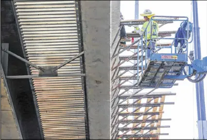  ?? JOHN SPINK / JSPINK@AJC.COM ?? Workers get northbound I-85 prepared for concrete during the repair work this past week for the bridge collapse. The project is expected to be completed by June 15. A fire caused a portion to collapse, resulting in fixes for 700 feet of the roadway.