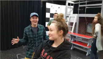  ?? Photo submitted to The McLeod River Post ?? The Holy Redeemer Drama Department is one month away from presenting their annual main stage production - Grease! Tickets go on sale on November 6th. Here, Thomas Pennings (Danny Zuko) sings to Jayna Fedorak (Sandy) while Austin Frazer (Kenickie) and Jaden Gauchier (Rizzo) look on in the background during one of the famous musical numbers.