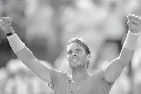  ?? AGENCE FRANCE PRESSE ?? Spain's Rafael Nadal celebrates after victory over Argentina's Juan Martin del Potro at the end of their men's singles semifinal match on day thirteen of The Roland Garros 2018 French Open tennis tournament in Paris.