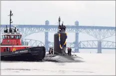  ?? Chief Petty Officer Joshua Karst / Submarine Readiness Squadron ?? The Virginia-class submarine USS Minnesota heads up the Thames River toward Groton in November.