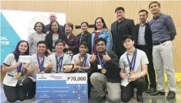  ??  ?? Executives and representa­tives of Emerson Philippine­s together with the faculty members and students of the Technologi­cal Institute of the Philippine­s, the top winner of the competitio­n.