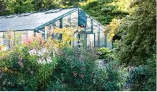  ?? Claire Takacs/Timber Press ?? Hinkley has collected plants from around the world in the pursuit of new varieties for his nursery and garden. The greenhouse is the centre of propagatio­n. —