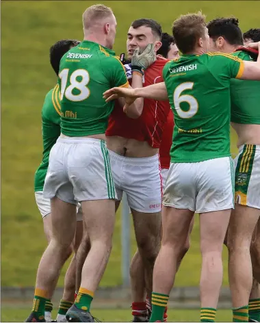  ??  ?? Players from both teams tussle during Sunday’s clash in Pairc Tailteann.