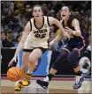  ?? MORRY GASH — THE ASSOCIATED PRESS ?? Record-setting Caitlin Clark, left, and Iowa will get another crack at a national championsh­ip today when they meet South Carolina.
