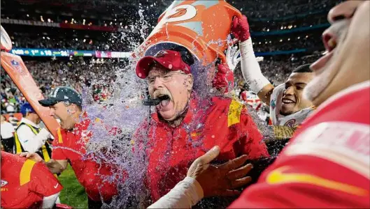  ?? Matt Slocum / Associated Press ?? Kansas City Chiefs head coach Andy Reid is dunked after their Super Bowl win against the Philadelph­ia Eagles on Sunday in Glendale, Ariz.