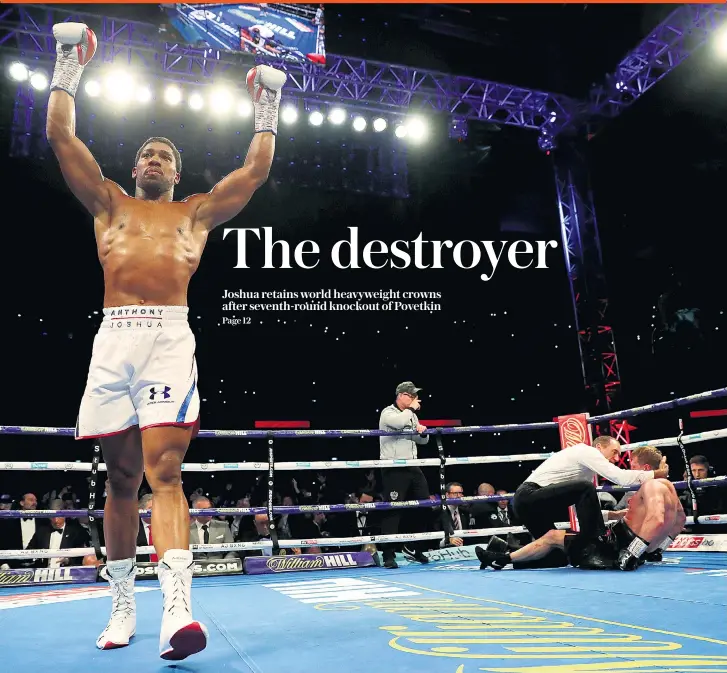  ??  ?? Moment of victory: Anthony Joshua turns to salute the crowd as the defeated Alexander Povetkin is left on the canvas in last night’s heavyweigh­t clash at Wembley Stadium