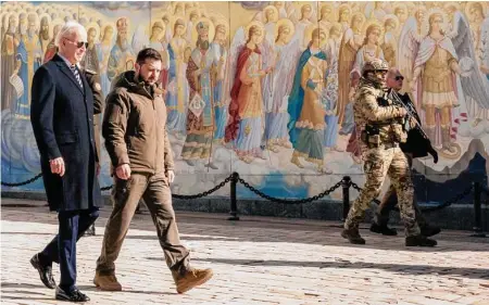  ?? Photos by Daniel Berehulak/New York Times ?? President Joe Biden walks with Ukrainian counterpar­t Volodymyr Zelenskyy at St. Michael’s monastery in Kyiv. Biden announced more military aid and met with Zelenskyy in a dramatic show of support days before the anniversar­y of Russia’s invasion.