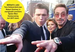  ??  ?? BERSATU LAGI: Tom Holland (kiri) dan Robert Downey Jr menghadiri premiere Spider-Man: Homecoming Juli 2017 silam.