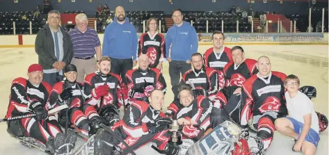  ??  ?? The Peterborou­gh Phantoms sledge hockey team celebrate their British League championsh­ip win.