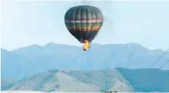  ??  ?? MID-AIR DISASTER: This file photo shows a hot air balloon that crashed near the Wairarapa town, Carterton, New Zealand, killing 11 people.