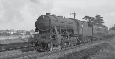  ?? R J Leonard/Kiddermins­ter Railway Museum ?? WD 2-10-0 No 73774 passes through Patchway station on Tuesday, 17 August 1948 on the first of its two down test trains between Acton yard, Stoke Gifford and Severn Tunnel Junction. Not surprising­ly, the ten-coupled WDs proved superior to the eight-coupled variants in terms of adhesion and boiler efficiency, even though on the Western Region the firemen tended to over fire, not being used to wide fireboxes. In terms of the average evaporatio­n of water in relation to coal burnt, the 2-10-0s were the most efficient, although when a GWR 2-8-0 was later tested using Welsh steam coal it pushed the 2-10-0s into second place.