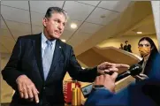  ?? ANDREW HARNIK / AP ?? Sen. Joe Manchin, D-W.VA., said he prefers a minimum 15% flat “patriotic tax” to ensure the wealthiest Americans don’t skip out on paying taxes.