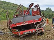  ?? (AFP) ?? Emergency personnel and security forces inspect the wreckage of a bus in Kericho, western Kenya, on Wednesday