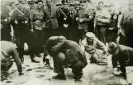  ??  ?? Jews scrub Vienna streets in a Nazi ‘purge’, 1938. Photograph: University of Southern California/Corbis/Getty Images