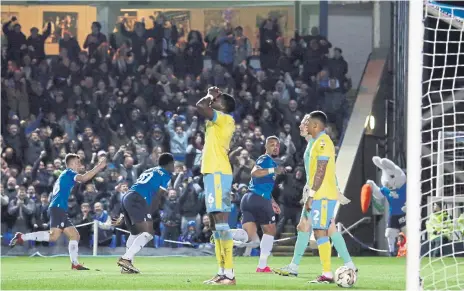  ?? ?? Jonson Clarke-Harris (blue, right) has just made it Posh 4, Sheffield Wednesday 0. Photo: Joe Dent/theposh.com.